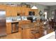 Well-lit kitchen featuring stainless steel appliances, granite countertops, and an eat-in island at 2692 E County Road 750 S, Clayton, IN 46118