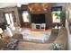 Comfortable living room featuring hardwood floors, large windows, and a ceiling fan at 2692 E County Road 750 S, Clayton, IN 46118