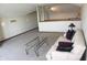 Lofted living room with a comfortable sofa, large glass coffee table, and neutral carpet at 2692 E County Road 750 S, Clayton, IN 46118