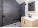 Well-lit bathroom features updated vanity and dark tile shower at 2741 Mars Hill St, Indianapolis, IN 46241