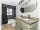 Updated bathroom with double sinks and tiled shower/tub combo at 2741 Mars Hill St, Indianapolis, IN 46241