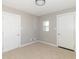 Bedroom with neutral carpet and paint with both a closet and doorway at 2741 Mars Hill St, Indianapolis, IN 46241