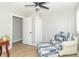 Bright bedroom with comfortable seating area and neutral wall color at 2741 Mars Hill St, Indianapolis, IN 46241