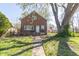 Charming brick home with landscaped front yard and a walkway leading to the front door at 2741 Mars Hill St, Indianapolis, IN 46241