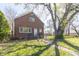 Traditional brick two-story home with mature trees, lawn, and a welcoming front entrance at 2741 Mars Hill St, Indianapolis, IN 46241