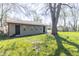 Shot of the detached garage showing the tree offering shade over the lawn on a sunny day at 2741 Mars Hill St, Indianapolis, IN 46241