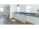A bright kitchen features modern cabinetry with a stylish countertop and a breakfast bar at 2741 Mars Hill St, Indianapolis, IN 46241