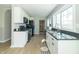 Bright kitchen with white cabinets, granite countertops, and stainless steel appliances at 2741 Mars Hill St, Indianapolis, IN 46241