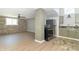 Kitchenette area with stainless steel appliances and beautiful light-colored floors at 2741 Mars Hill St, Indianapolis, IN 46241