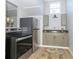 Kitchenette with stainless steel appliances and stylish wooden cabinets at 2741 Mars Hill St, Indianapolis, IN 46241