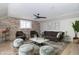 Comfortable living room features stone accent wall, neutral tones, and modern furniture at 2741 Mars Hill St, Indianapolis, IN 46241