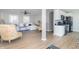 Open-concept living space featuring hardwood floors, stylish furnishings, and a seamless flow to the kitchen at 2741 Mars Hill St, Indianapolis, IN 46241