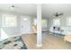 Bright and airy living room with hardwood floors, a comfortable sofa, and plenty of natural light at 2741 Mars Hill St, Indianapolis, IN 46241
