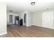 Spacious living room with hardwood floors and stainless steel appliances in the connected kitchen at 2741 Mars Hill St, Indianapolis, IN 46241
