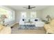 Inviting living room with hardwood floors, a comfortable sofa, and an abundance of natural light at 2741 Mars Hill St, Indianapolis, IN 46241