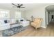 Spacious living room featuring hardwood floors, a plush sofa, and stylish decor at 2741 Mars Hill St, Indianapolis, IN 46241