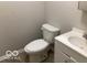This bathroom features a toilet and a white single sink vanity at 2823 N Gladstone Ave, Indianapolis, IN 46218