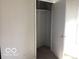 Empty bedroom closet with an open door showing the available storage space at 2823 N Gladstone Ave, Indianapolis, IN 46218