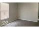 Bedroom with a window, neutral walls, and carpeted floor, ready for personalization at 2823 N Gladstone Ave, Indianapolis, IN 46218
