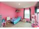 Vibrant pink bedroom with a window and whimsical decor at 2960 W Patchwork Dr, Monrovia, IN 46157