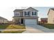 Beautiful two-story home featuring gray siding, a two-car garage, and a concrete driveway at 2960 W Patchwork Dr, Monrovia, IN 46157