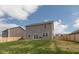 View of the house exterior showcasing a spacious yard and a fenced boundary at 2960 W Patchwork Dr, Monrovia, IN 46157