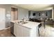 Open concept kitchen and living area with stainless steel appliances and hard surface countertops at 2960 W Patchwork Dr, Monrovia, IN 46157