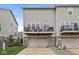 Townhome exterior showcasing a back deck and two-car garage at 3527 Brampton Ln, Westfield, IN 46074