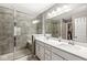 Modern bathroom with double sink vanity, quartz countertop and a sleek tiled walk-in shower at 3527 Brampton Ln, Westfield, IN 46074