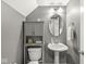 Half bathroom with gray vanity, stylish cabinet, and updated fixtures offers convenience for guests at 3527 Brampton Ln, Westfield, IN 46074