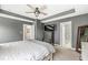 Spacious bedroom boasts great ceiling fan, TV and a view of the en-suite bathroom at 3527 Brampton Ln, Westfield, IN 46074