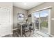 Cozy dining area with sliding glass doors leading to a balcony, perfect for enjoying outdoor meals at 3527 Brampton Ln, Westfield, IN 46074
