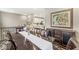 Open-concept dining area featuring a dark wood table with a view into the kitchen at 3527 Brampton Ln, Westfield, IN 46074