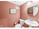 Clean half bathroom with a pedestal sink, toilet, and fresh paint at 3527 Brampton Ln, Westfield, IN 46074