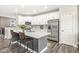 Well-lit kitchen boasts stainless steel appliances, a stylish island, and ample storage space at 3527 Brampton Ln, Westfield, IN 46074