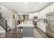 Spacious kitchen with island seating, white cabinets, and modern appliances offering a functional design at 3527 Brampton Ln, Westfield, IN 46074