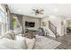 Relaxing living room with a ceiling fan, staircase and cozy furniture arrangement for comfort at 3527 Brampton Ln, Westfield, IN 46074
