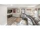 Cozy living room with a comfortable sectional sofa, wooden floors and sports memorabilia at 3527 Brampton Ln, Westfield, IN 46074