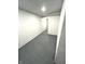 Unfinished basement with painted concrete floor and walls, showing ample space at 359 N Jefferson St, Martinsville, IN 46151