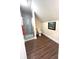 Bathroom featuring tiled walk-in shower with glass doors, toilet, and wooden-look flooring at 359 N Jefferson St, Martinsville, IN 46151