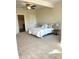 Bedroom featuring neutral carpet, ceiling fan, and modern fixtures, and en-suite bathroom at 359 N Jefferson St, Martinsville, IN 46151