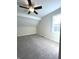 Bedroom featuring neutral carpet, ceiling fan, and large window with lots of natural light at 359 N Jefferson St, Martinsville, IN 46151