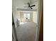 Bedroom featuring large window with natural light, neutral carpet, ceiling fan, and modern fixtures at 359 N Jefferson St, Martinsville, IN 46151