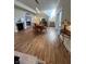 Dining area with fireplace, wood floors, stairs, and glass sliding doors at 359 N Jefferson St, Martinsville, IN 46151
