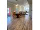 Open dining and living area with hardwood floors, fireplace, and natural light at 359 N Jefferson St, Martinsville, IN 46151