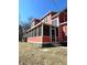 A spacious screened-in porch perfect for outdoor relaxation, attached to this charming two-story home at 359 N Jefferson St, Martinsville, IN 46151