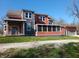 Charming two-story home featuring a screened in porch, garage, and appealing two-tone color scheme at 359 N Jefferson St, Martinsville, IN 46151