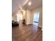 Hallway featuring hardwood floors, neutral paint colors, access to bedroom, and a comfortable sitting area at 359 N Jefferson St, Martinsville, IN 46151