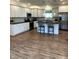Spacious kitchen featuring white cabinets, black counters, and a large island at 359 N Jefferson St, Martinsville, IN 46151