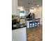 Bright kitchen with white cabinets, black countertops, and stainless-steel appliances at 359 N Jefferson St, Martinsville, IN 46151